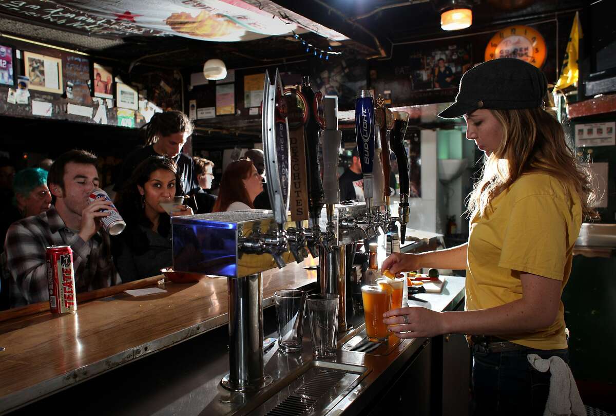 Bartender Jane Hurley serves customers at the Kingfish pub, Thursday February 9, 2012, in Oakland, Calif. This old bait shop which has turned into a bar is now being designated as a landmark, because of the love from it's customers.