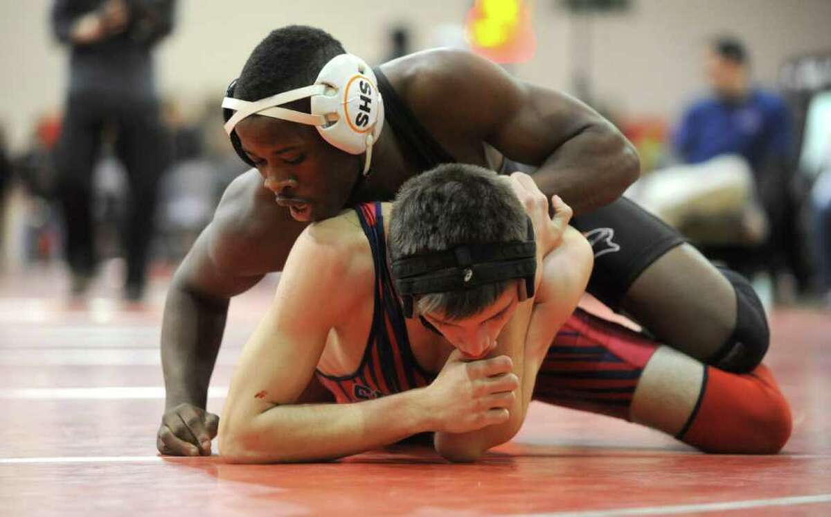 Ben Pierre Saint of Stamford wrestles againt James McQuillan of McMahon in the 132-pound weight class of the FCIAC wrestling semi-finals at New Canaan High School on Saturday, February 11, 2012. Pierre Saint is looking to avenge last year's title loss in the State Open