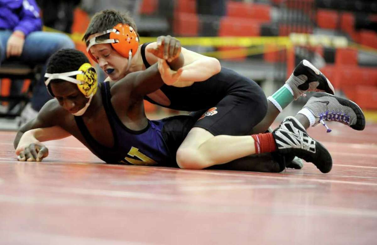 Kevin Side of Ridgefield wrestles against Pascal Medor of Westhill in the 106-pound weight class of the FCIAC wrestling semi-finals at New Canaan High School on Saturday, February 11, 2012.