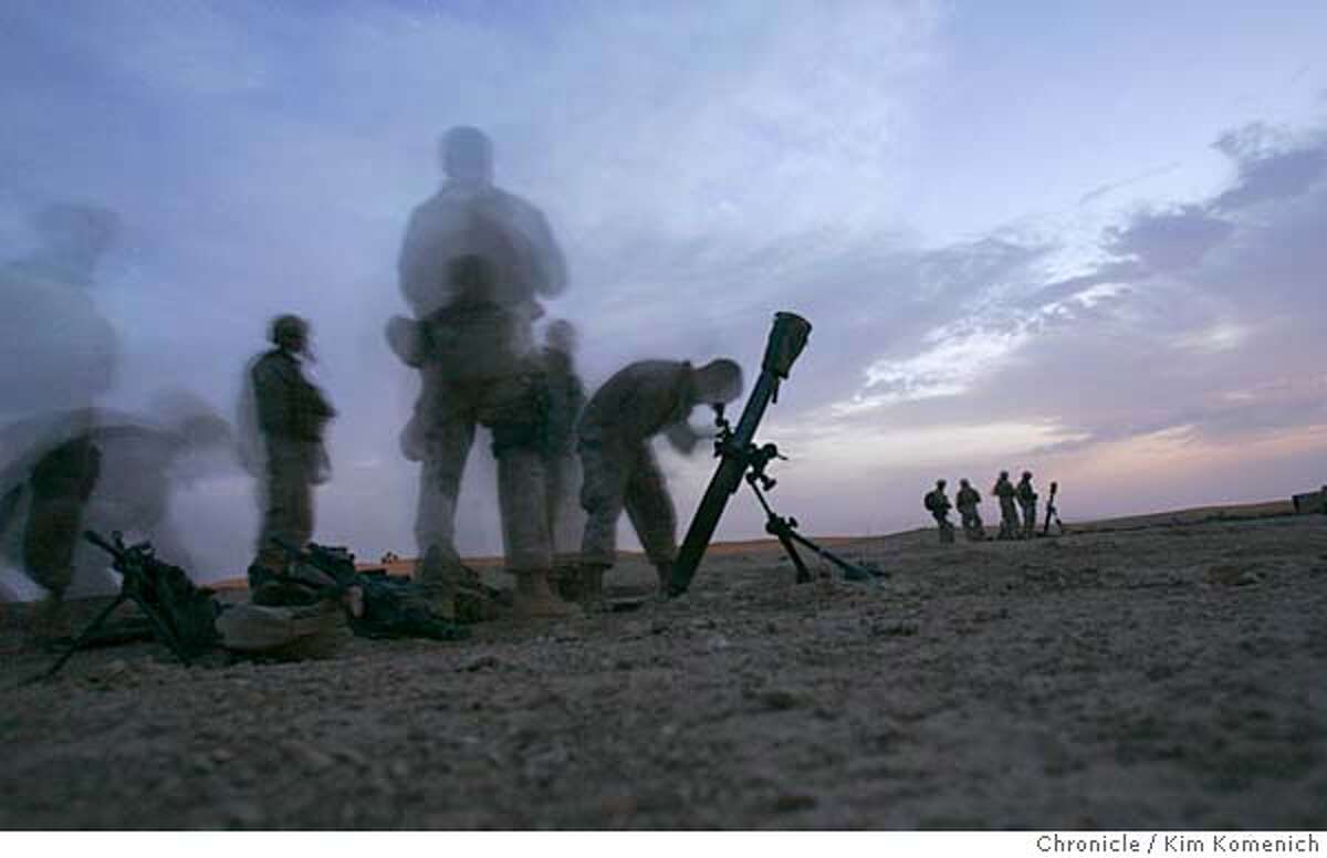 IRAQ30_BORDER_0048_KK.JPG After sunset Thursday, Marines from the 1st Mobile Assault Platoon, Weapons Company, 3rd Battalion, 6th Marine Regiment set up mortars near the Syria-Iraq border. This photo is a 10-second time exposure. San Francisco Chronicle Photo by Kim Komenich 9/29/05
