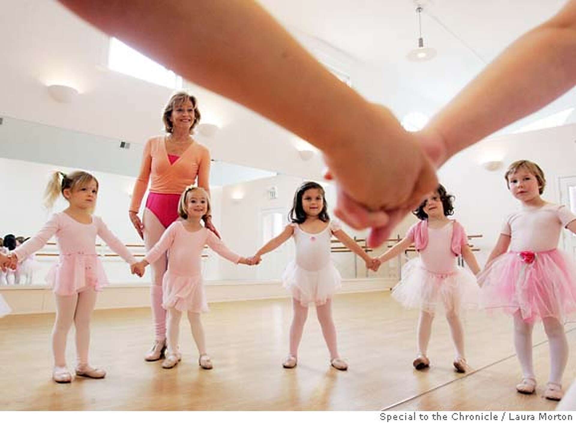 Little girls flock to Miss Tilly to learn the magic