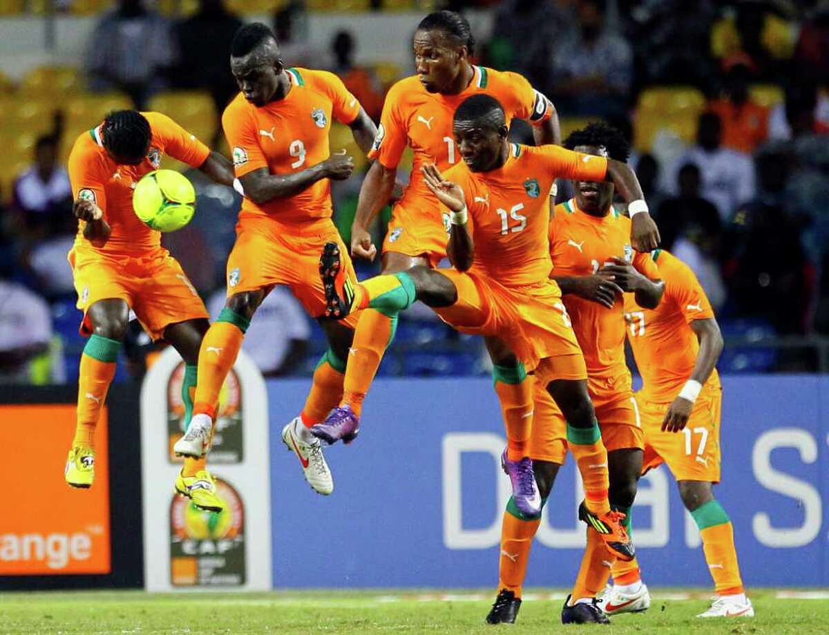 Didier Drogba (third from left) and the Ivory Coast wall stop a free kick during the African Cup of Nations final against Zambia in Libresville, Gabon. Zambia won on penalty kicks.