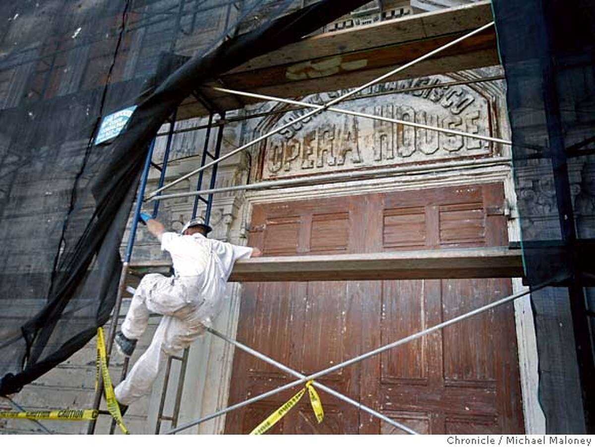 The front of the historic opera house built in 1888 is undergoing renovation as part of a city project (NOTE : this is not connected to the work SWA Group is doing). Jimmy Ford of the SF DPW climbs down from the scaffolding. On Friday Oct. 19, a ceremony will celebrate a public-private partnership creating a major facelift for one of San Francisco�s historic landmarks, the Bayview Opera House. Locally-based SWA Group, a landscape architecture firm is leading a pro-bono implementation in celebration of the firm�s 50th anniversary. The community celebration on Friday culminates a two-day transformation of the Bayview Opera House grounds on Third Street in San Francisco. Photo taken on 10/18/07. Photo by Michael Maloney / San Francisco Chronicle ***Jimmy Ford MANDATORY CREDIT FOR PHOTOG AND SF CHRONICLE/NO SALES-MAGS OUT