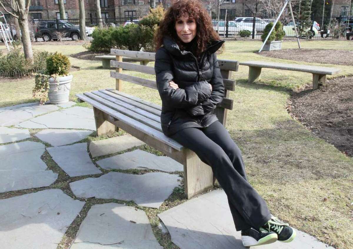 In this Feb. 10, 2012 photo, Jane Byron poses for a photograph in a park near her home in the Queens borough of New York. Byron, 51, a nurse, has had two knee replacements. Costly knee replacements have more than tripled in people aged 45-64 in recent years and a study released last week found that nearly 1 in 20 Americans older than 50 have these artificial joints. But active boomers can avoid that kind of drastic treatment by properly managing aches and pains. (AP Photo/Tina Fineberg)