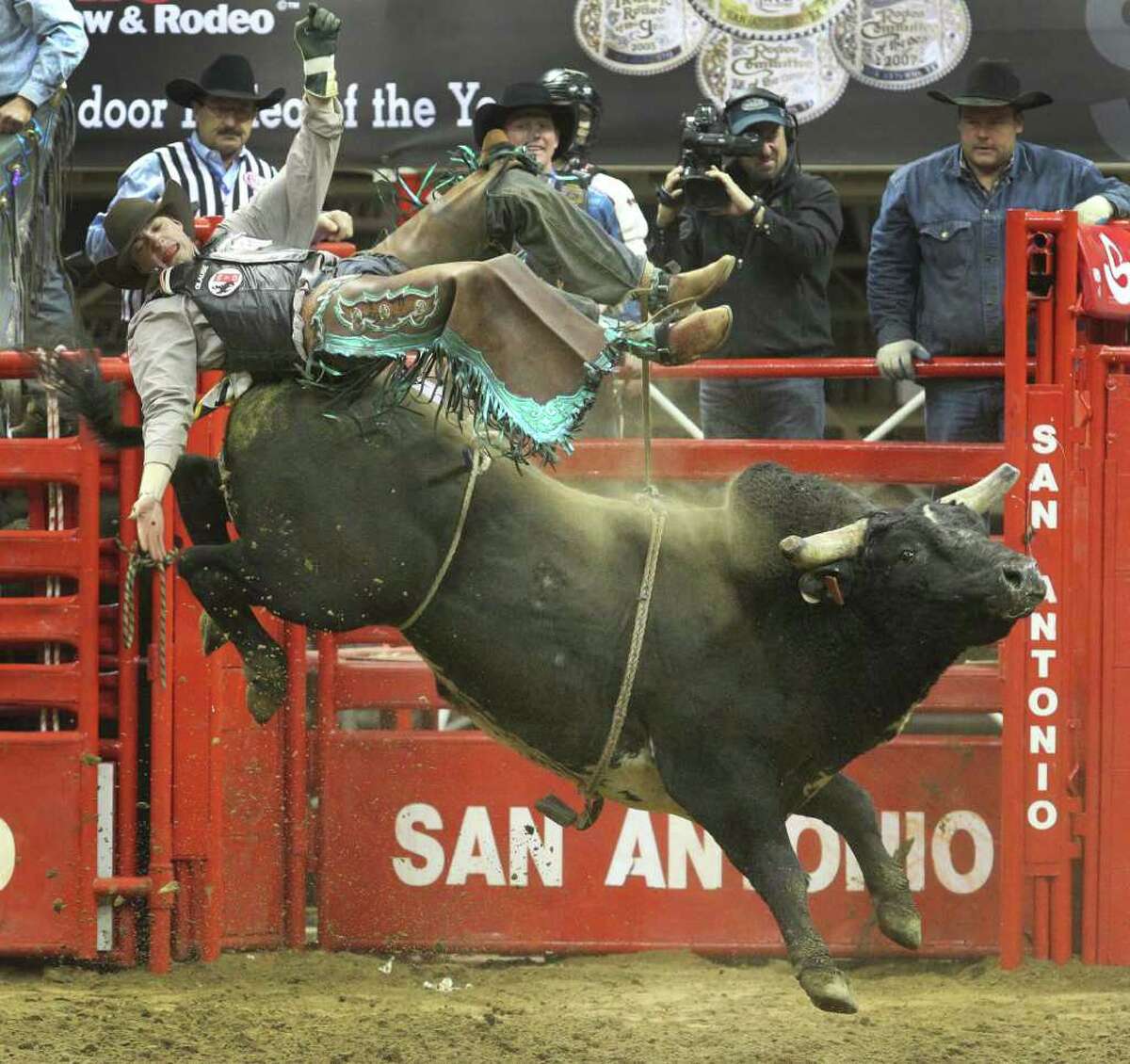Seth Glause of Cheyenne, Wyo., flies off a bull Sunday, Feb. 12, 2012 during the bull riding competition at the San Antonio Stock Show & Rodeo.
