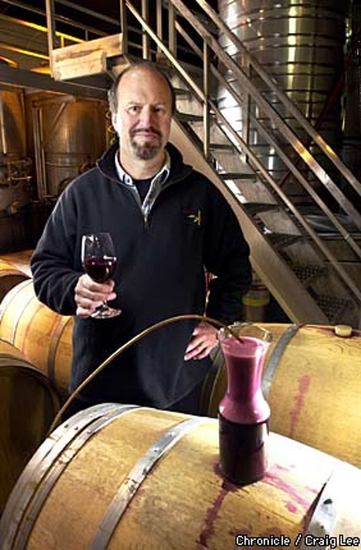 Michael Havens of Havens Wine Cellars in Napa is a pioneer in micro-oxygenation, designed to soften wine's tannins. Photo of Michael Havens with a demonstration of wine being micro-oxygenated with the effects of the bubble like foam on top of the wine. Photo by Craig Lee/San Francisco Chronicle