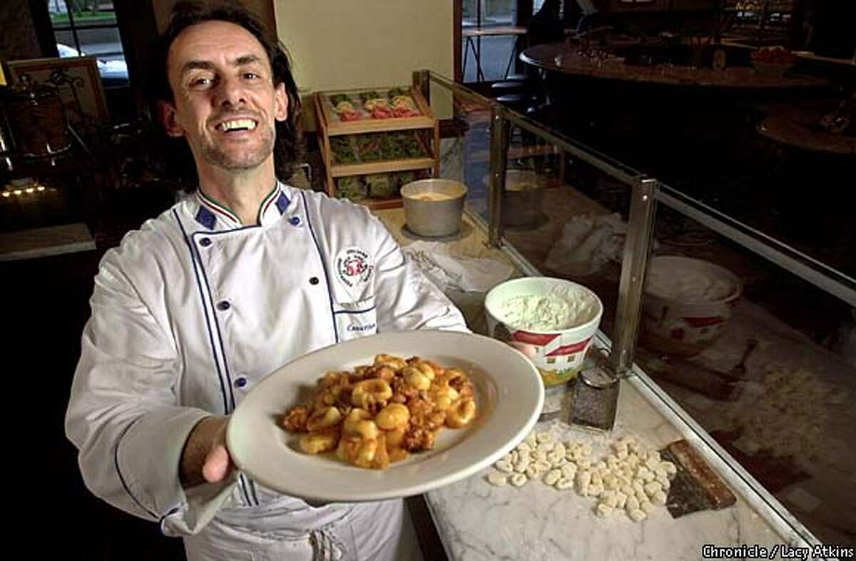 Work of Art: Maurizio Mazzon, executive chef of Il Fornaio, proudly displays gnocchi. Chronicle photo by Lacy Atkins