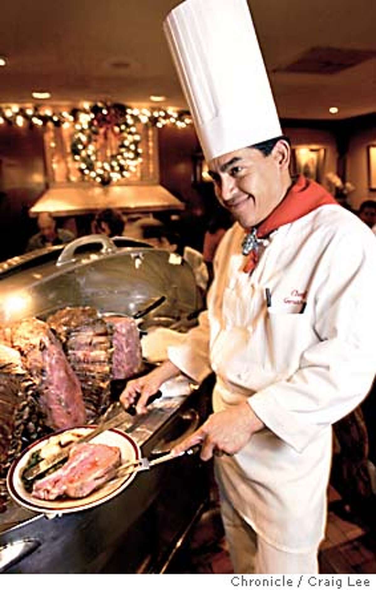 Story about how to cook prime rib. Photo of chef Gerardo Ramirez at the House of Prime Rib restaurant in San Francisco on Van Ness Avenue, carving up a piece of prime rib. Event on 12/8/03 in San Francisco. CRAIG LEE / The Chronicle