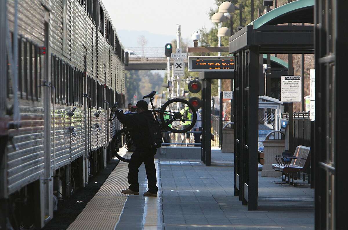 FILE PHOTO: A passenger boards a northbound Caltrain at the station in Mountain View, Calif., on Thursday, February 9, 2012. A train hit a person Tuesday, Oct. 1, 2019.