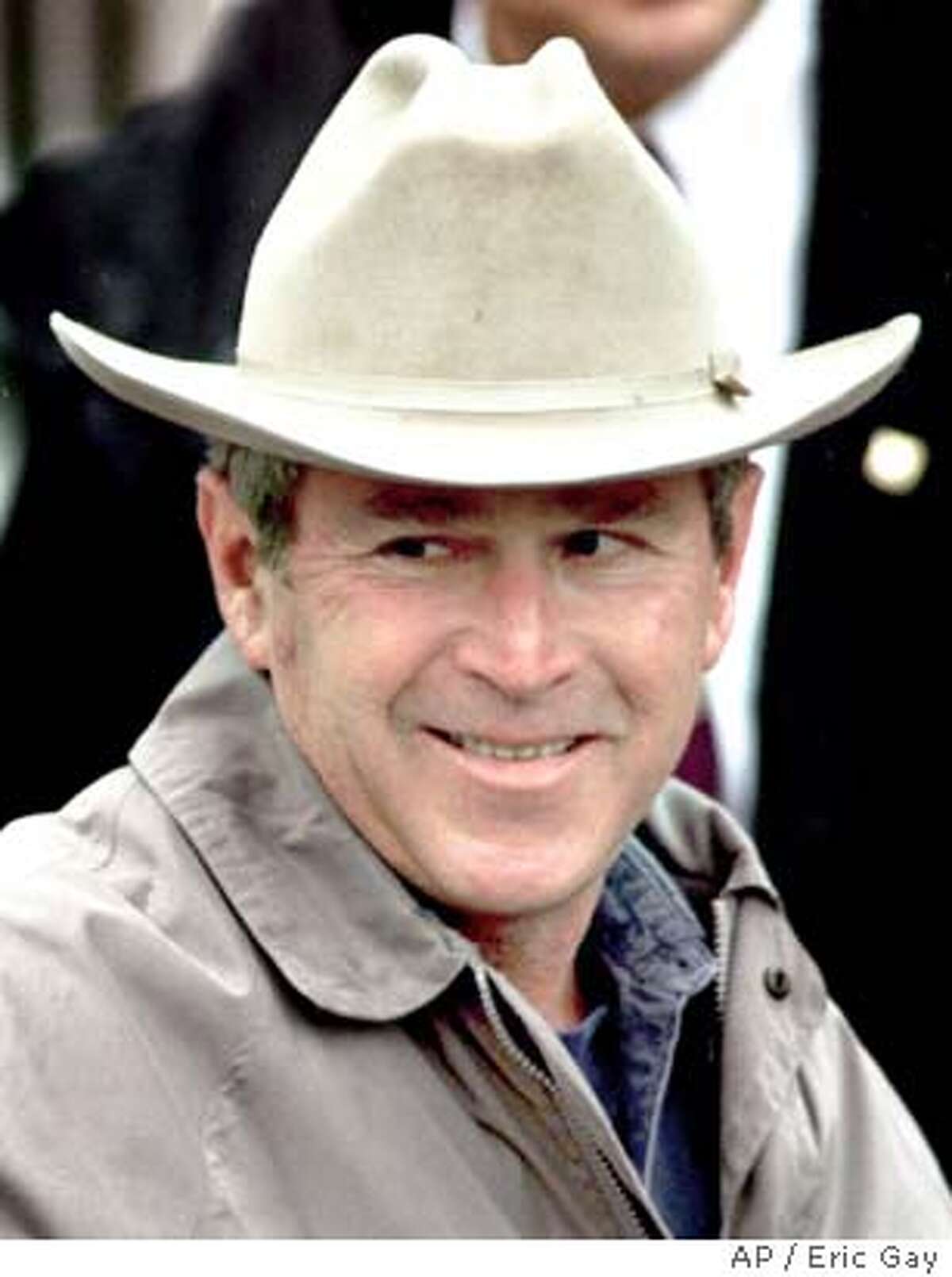 Then-governor George W. Bush arrives at the Texas governor's mansion in a photo from November, 2000. Associated Press photo by Eric Gay