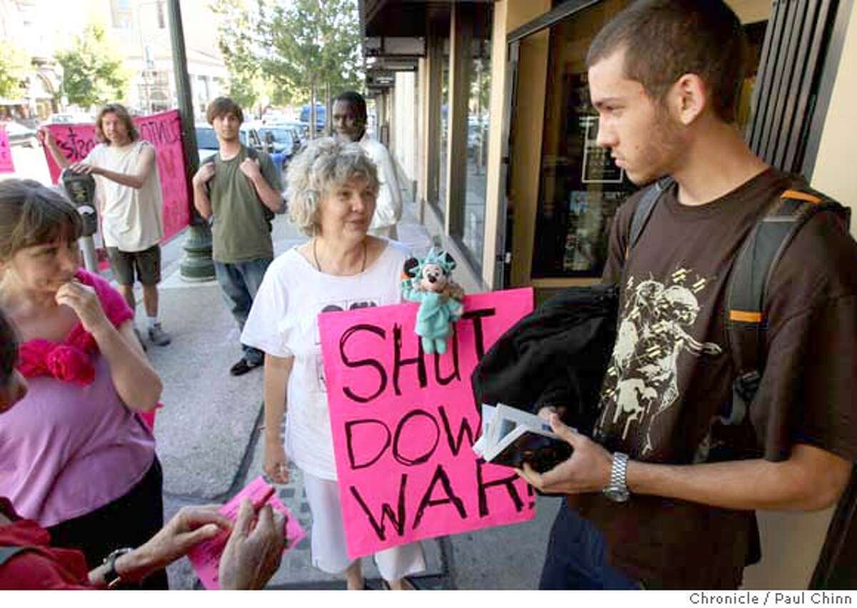 Phoebe Sorgen (center), a demonstrator with Code Pink, tries to convince 17-year-old David Felkins (right) from enlisting in the military after he visited the Marine Corps recruiting office in Berkeley, Calif. on Wednesday, Oct. 3, 2007. PAUL CHINN/The Chronicle **Phoebe Sorgen, David Felkins MANDATORY CREDIT FOR PHOTOGRAPHER AND S.F. CHRONICLE/NO SALES - MAGS OUT
