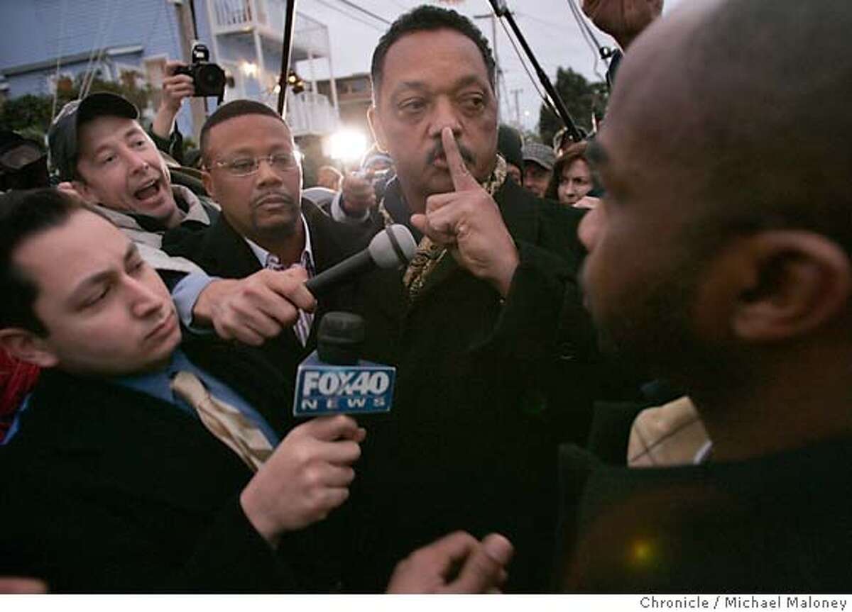 Outside the San Quentin gates, the Reverend Jesse Jackson signals to a heckler to be quiet after visiting Stanley Williams for the 2nd time. The vigil outside the gates to San Quentin Prison where Stanley "Tookie" Williams was to be executed shortly after midnight, Tuesday morning December 13, 2005. Pro and anti death penalty advocates were on hand to voice and demonstrate their views. Williams, once the leader of the Crypts gang was convicted and sentenced to death for 4 murders. The governor refused clemency for Williams Monday. Event in San Quentin, CA Photo by Michael Maloney / The Chronicle