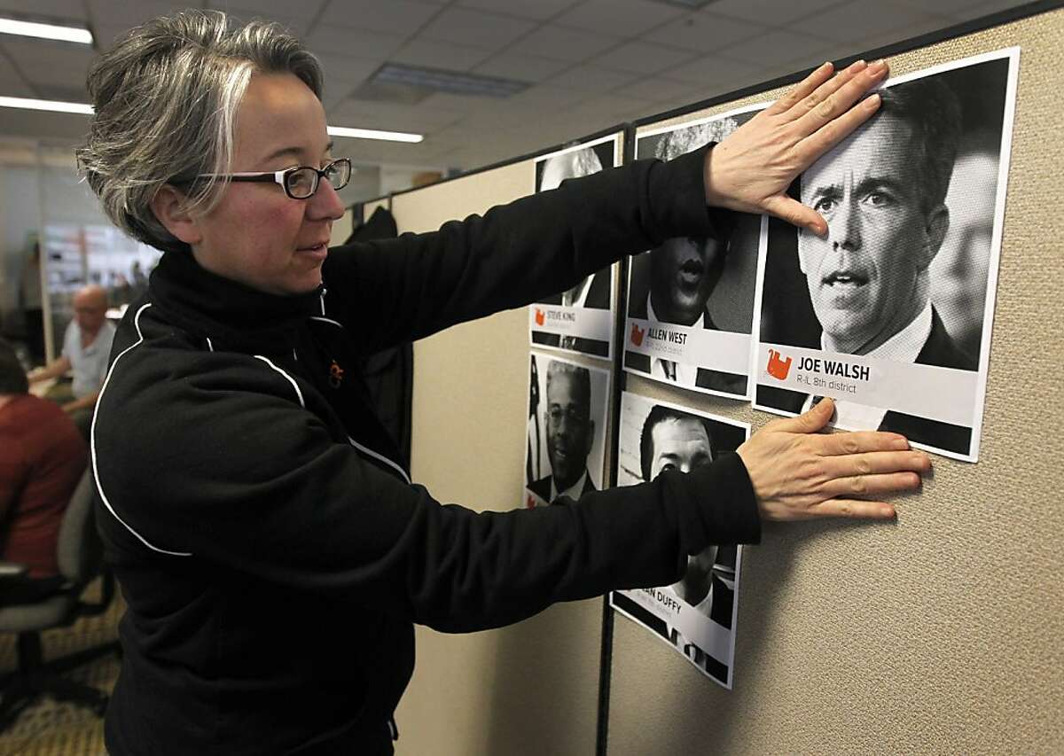 Becky Bond posts photos of Tea Party congressional members in Credo Mobile's super PAC nerve center in San Francisco on Friday. Bond is the political director of the telecommunication firm's newly-formed political action committee which is taking aim at several Tea Party politicians.
