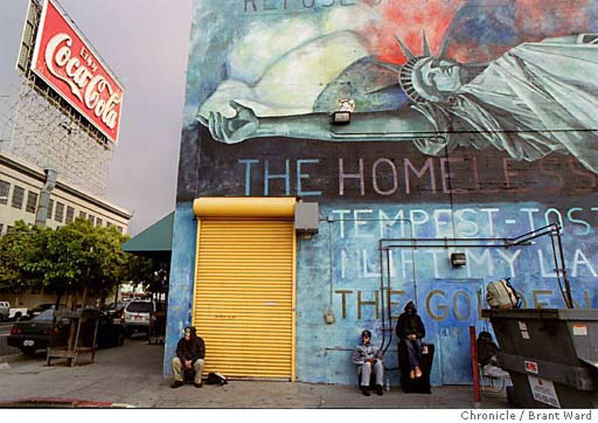 SHELTER. Inside the San Francisco homeless shelter at Fifth and Brannan Streets...the shelter is divided into two floors...those on the bottom floor sleep on thin mattresses. The rear of the Fifth St. shelter is adorned with a mural about homelessness...here some men wait for the shelter to reopen after it is closed for cleaning. BRANT WARD / The Chronicle