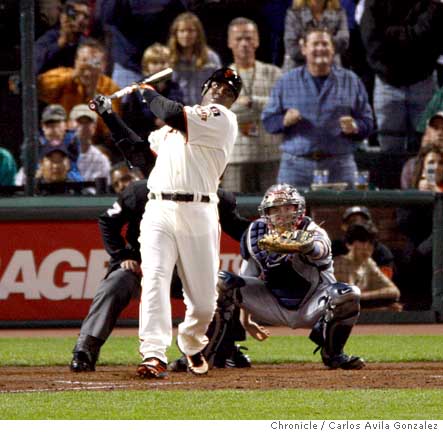 San Francisco Giants Barry Bonds speaks to the sold out crowd with his god  father Willie Mays by his side after hitting career home run number 756 in  the fifth inning against