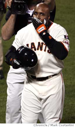 San Francisco Giants Barry Bonds speaks to the sold out crowd with his god  father Willie Mays by his side after hitting career home run number 756 in  the fifth inning against