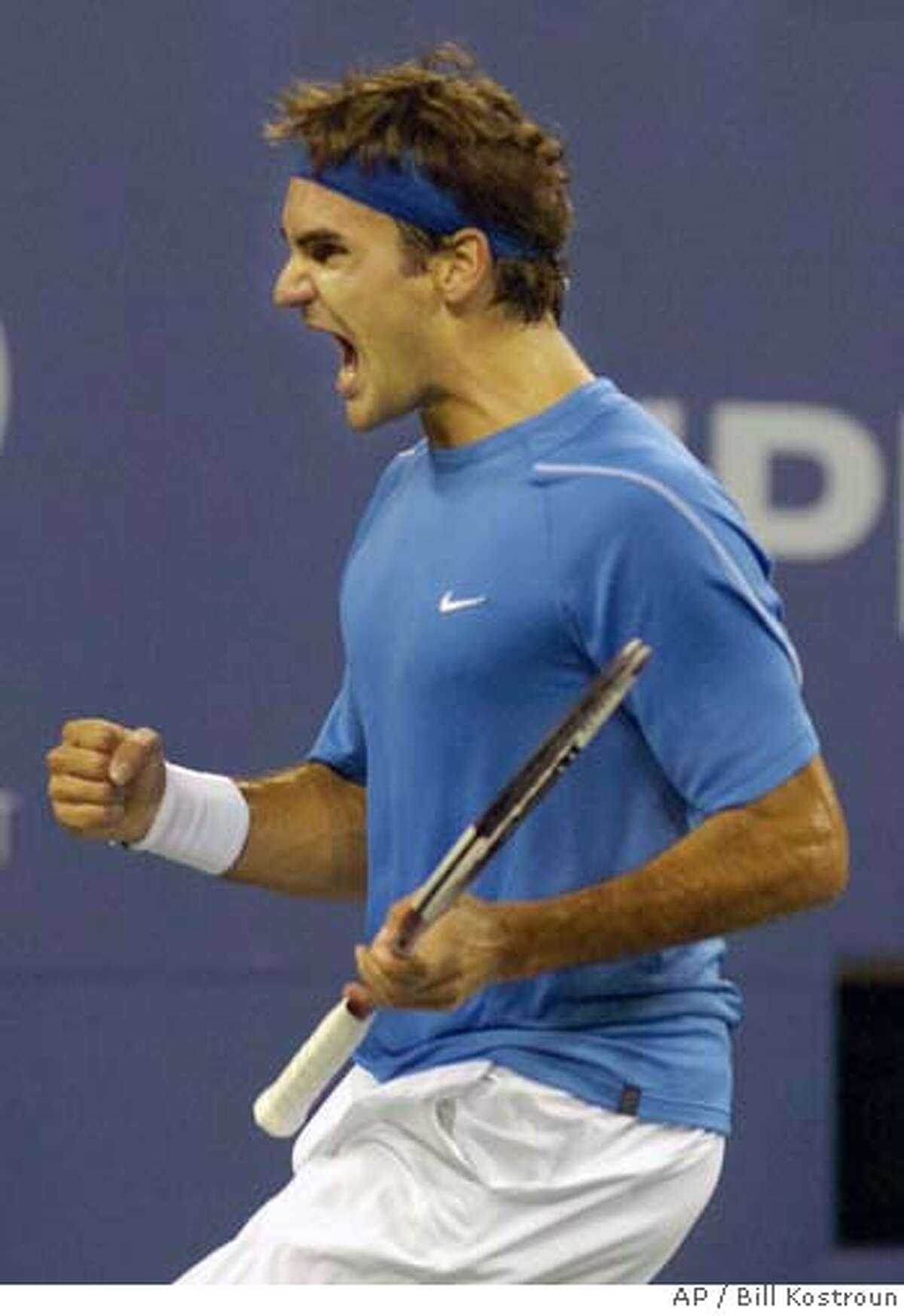 Roger Federer, of Switzerland, reacts after winning the first set against James Blake, of the United States, at the US Open tennis tournament in New York, Thursday, Sept. 7, 2006. (AP Photo/Bill Kostroun)