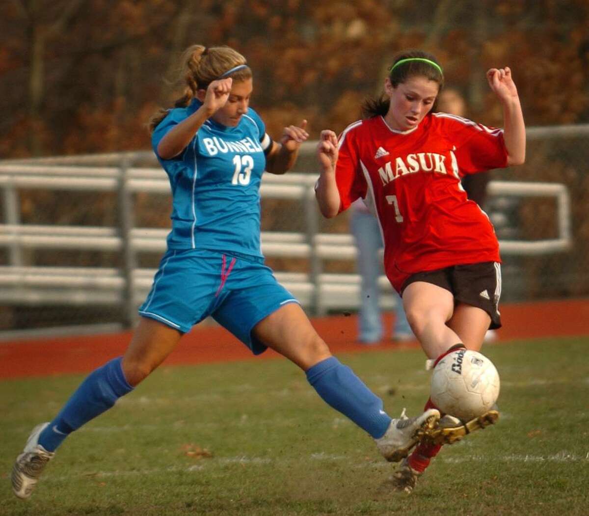 Bunnell's Bridgette Dolio, left, and Masuk's Aislinn McKeown converge on the ball during Monday's matchup in the opening round of the Class L state playoffs.