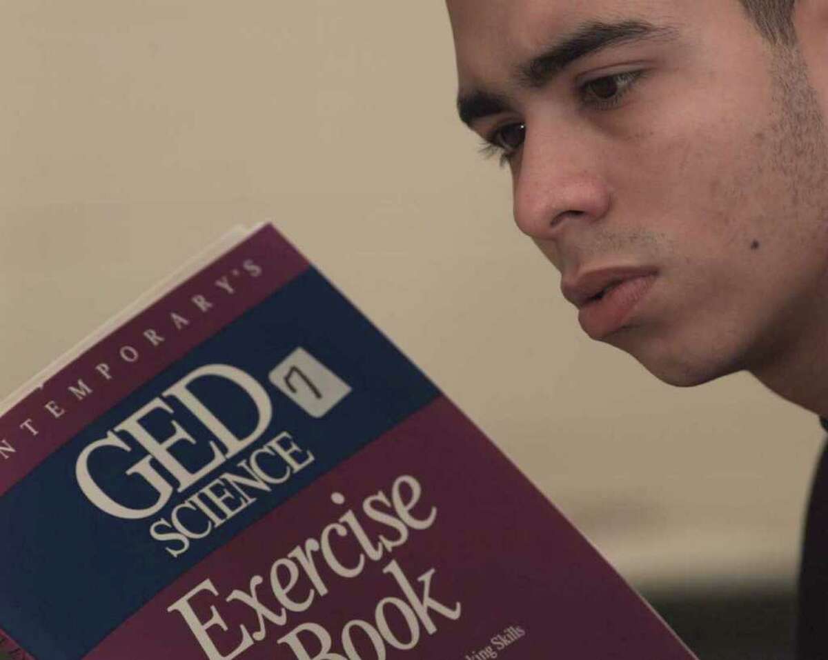 The state is considering alternative pathways to the high school equivalency diploma because the for-profit company that runs and administers the GED test is planning a substantial cost increase. Here, a student is pictured studying for his high school equivalency diploma in a 1995 file photo. (Luanne M. Ferris / Times Union archive)