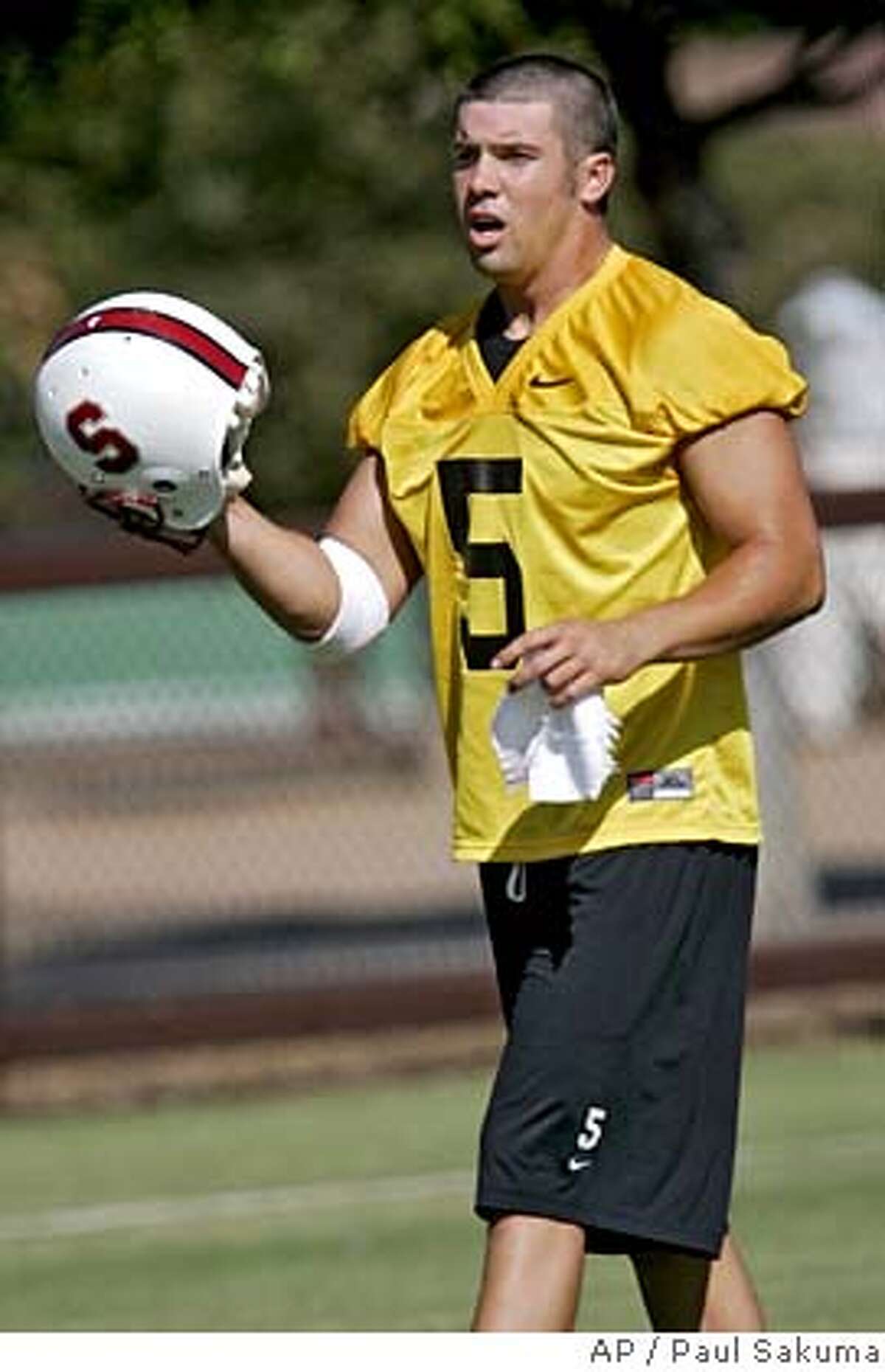 ** ADVANCE FOR WEEKEND EDITIONS, AUG. 12-13 ** Stanford quarterback Trent Edwards takes off his helmet during practice in Stanford, Calif., Tuesday, Aug. 8, 2006. Stanford is preparing for the Pac-10 football season. (AP Photo/Paul Sakuma) ** ADVANCE FOR WEEKEND EDITIONS, AUG. 12-13 **