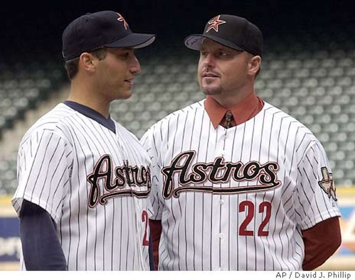 Former New York Yankee pitchers Roger Clemens, right, and Andy Pettitte talk on the pitchers mound after a news conference with the Houston Astros Monday, Jan. 12, 2004 in Houston. Clemens is pushing back his retirement, agreeing to a one-year contract with the Astros. (AP Photo/David J. Phillip)