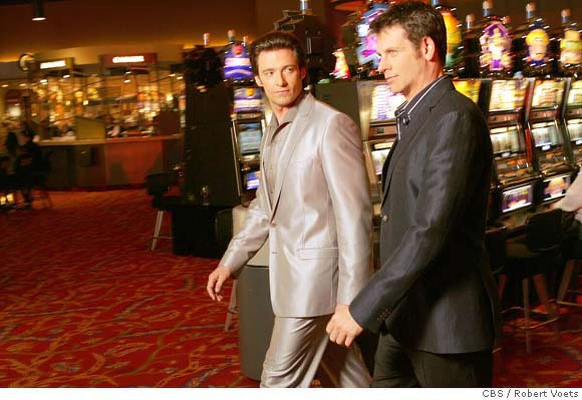 "Pilot" -- Ripley (Lloyd Owen, right) and Nicky (Hugh Jackman) discuss the casino business on, VIVA LAUGHLIN which will premiere on a special night, Thursday, Oct. 18 (10:00-11:00 PM ET/PT) on the CBS Television Network. Photo: Robert Voets/CBS �2007 CBS Broadcasting Inc. All Rights Reserved.
