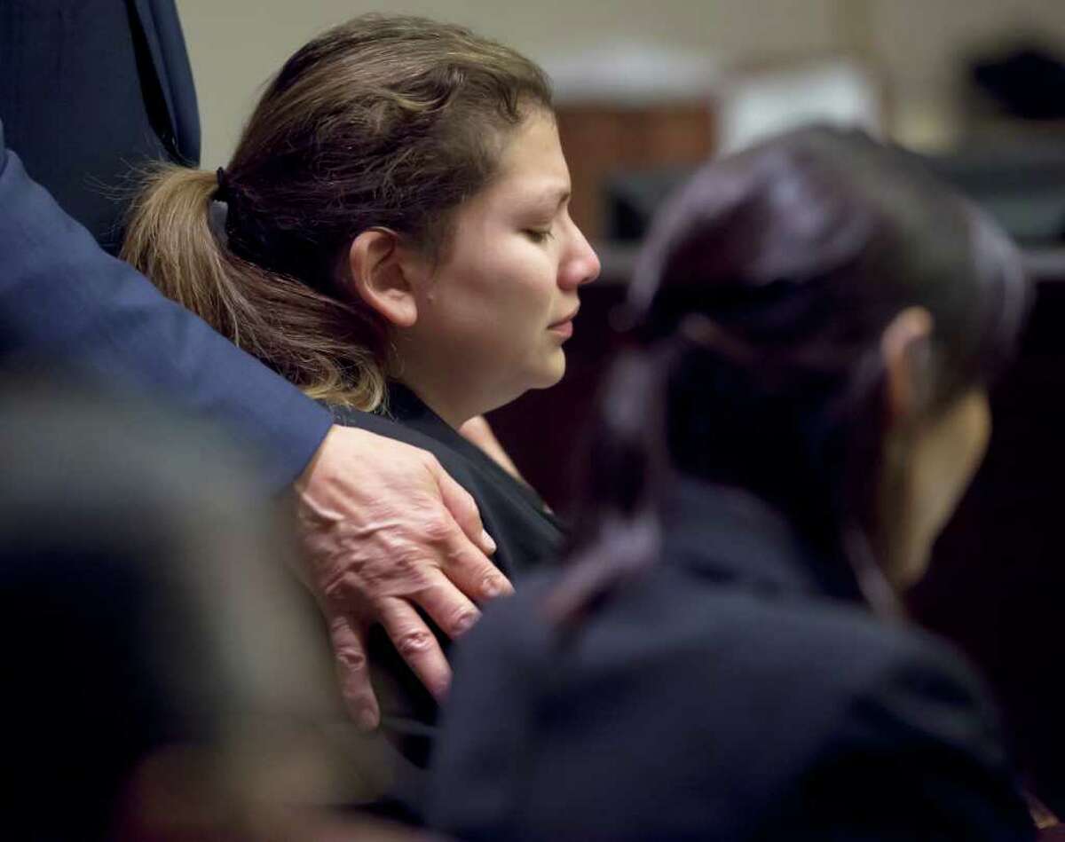Defense attorney Roy Barrera Jr. places his hands on the shoulders of Jenny Ann Ybarra during closing arguments in the punishment phase of her intoxication manslaughter trial Wednesday, Feb. 15, 2012 in the 437th District Court.