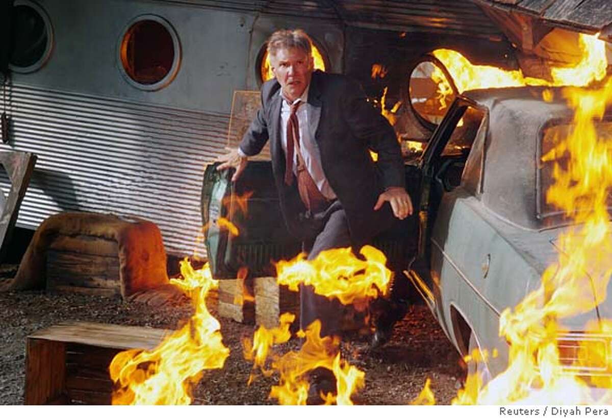 "Firewall" -- Harrison Ford, banker turned near human torch. It's like "Taken" with computers.