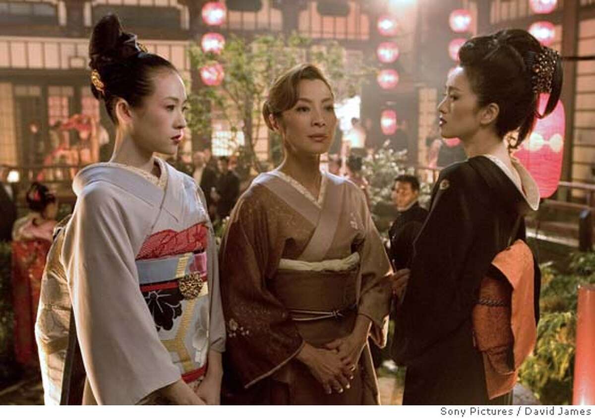 In this photo released by Sony Pictures, actresses, from left, Ziyi Zhang, Michelle Yeoh and Gong LI appear a scene from the new film, "Memoirs of a Geisha." The filmmakers find themselves defending their decision to look beyond Japan, where the film takes place, when they searched for their leading ladies. Zhang and Gong are Chinese, and Yeoh is Malaysian-Chinese. (AP Photo/Sony Pictures, David James)