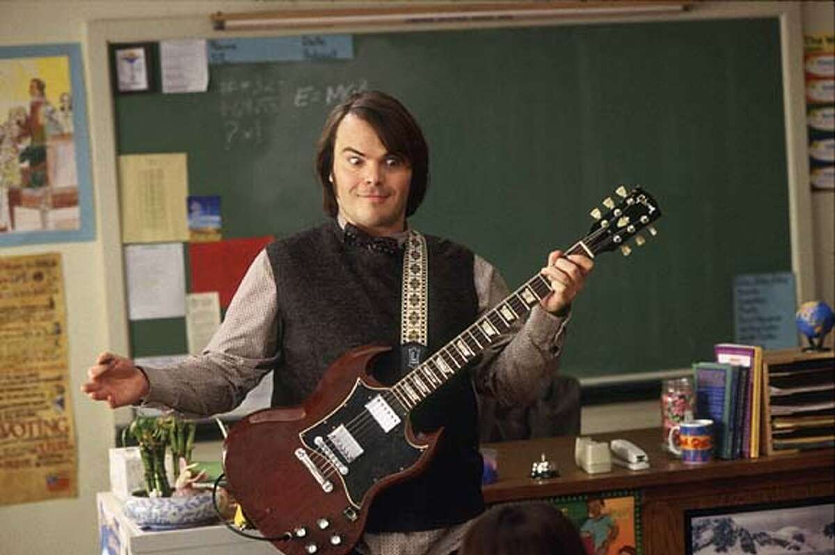 Actor Jack Black portrays a down and out rock star Dewey Finn who gets fired from his band and who faces a mountain of debts and depression in a scene from his new comedy film "School of Rock" in this undated publicity photograph. The film opens September 26 in the United States. REUTERS/Paramount Pictures/Handout