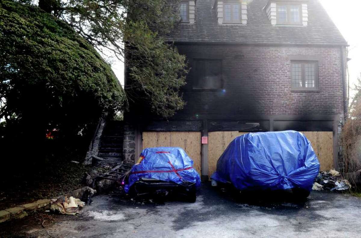A Sunday night fire at 22 Alden Road in central Greenwich burned a home's three-car garage, pictured here Tuesday, Feb. 14, 2012. The fire began in a Mini Cooper parked in the garage, a fire official said Wednesday.