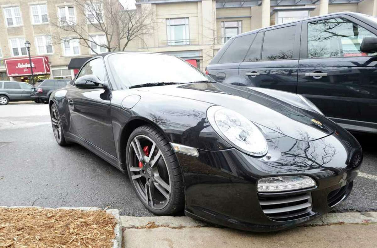 A black Porsche convertible parked on Greenwich Avenue Wednesday, Feb. 15, 2012.