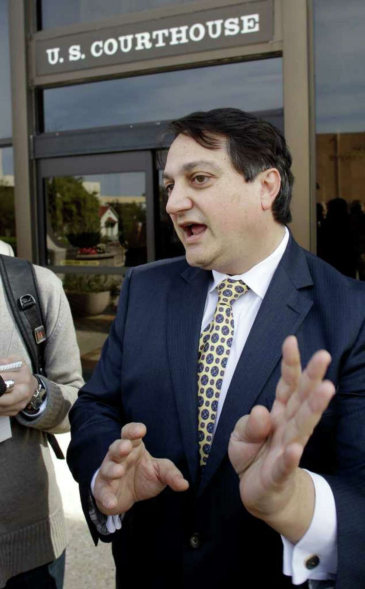 Steve Munisteri, Republican Party of Texas chairman, talks to the media following the federal court hearing in San Antonio.