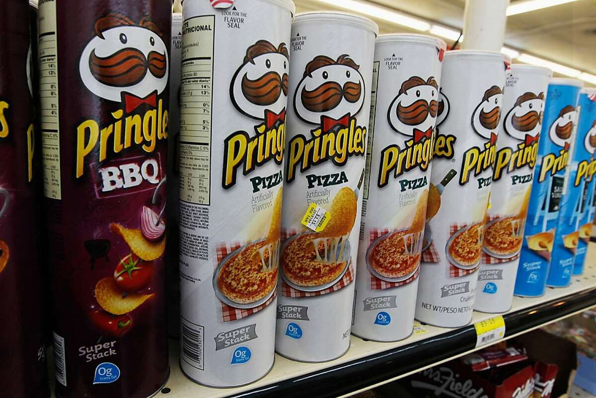 MIAMI, FL - FEBRUARY 15: Packages of Pringles chips are seen on desplay at a convience store on February 15, 2012 in Miami, Florida. Procter & Gamble announced it will sell its Pringles product line to cereal-maker Kellogg for $2.7 billion after a deal with Diamond Foods fell through. (Photo by Joe Raedle/Getty Images)