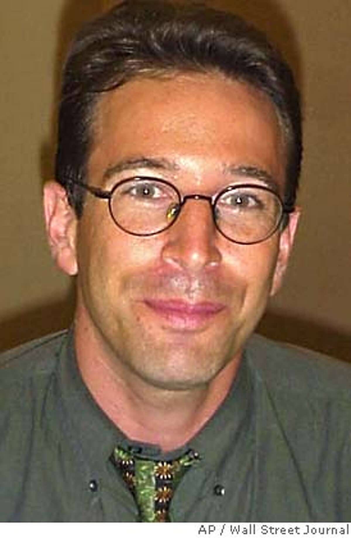 ** FILE ** Wall Street Journal reporter Daniel Pearl is shown in this undated file photo. American authorities investigating the killing of Pearl in Pakistan now believe that he was slain by Khalid Shaikh Mohammed, the alleged mastermind of the Sept. 11 attacks. (AP Photo/Wall Street Journal) ALSO RAN: 1/1/2004 Daniel Pearl, left, was slain by Khalid Shaikh Mohammed, right, U.S. officials say. Photo caption pearl22_PH11012003200WALL STREET JOURNAL** FILE ** Wall Street Journal reporter Daniel Pearl is shown in this undated file photo. American authorities investigating the killing of Pearl in Pakistan now believe that he was slain by Khalid Shaikh Mohammed, the alleged mastermind of the Sept. 11 attacks. (AP Photo-Wall Street Journal)__NO SALES UNDATED PHOTO cat UNDATED PHOTO This photo was in an early 2002 e-mail saying Daniel Pearl was being held to protest treatment of prisoners at Guantanamo Bay. Judea Pearl speaks at an Arlington, Va., ceremony honoring 31 journalists who died in the line of duty in 2002. Ran on: 09-10-2005 Daniel Pearls killing has led his father on a quest to foster understanding between Jews and Muslims. Ran on: 09-10-2005 Daniel Pearls killing has led his father on a quest to foster understanding between Jews and Muslims. Nation#MainNews#Chronicle#1/1/2004#ALL#3star##0421449659