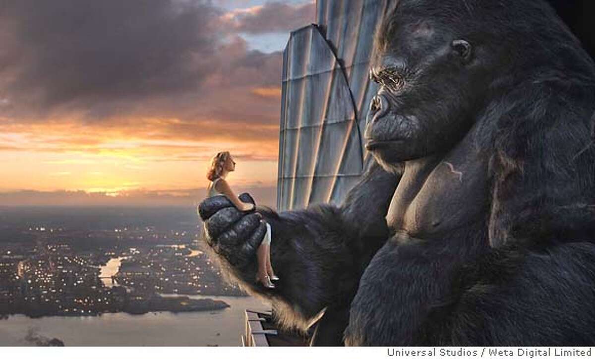 In this photo provided by Universal Studios, Ann Darrow (Naomi Watts) shares a quiet moment at sunrise with Kong atop the Empire State Building, whose heights he has scaled in his flight from the streets of New York City, in " ." (AP Photo/Universal Studios)