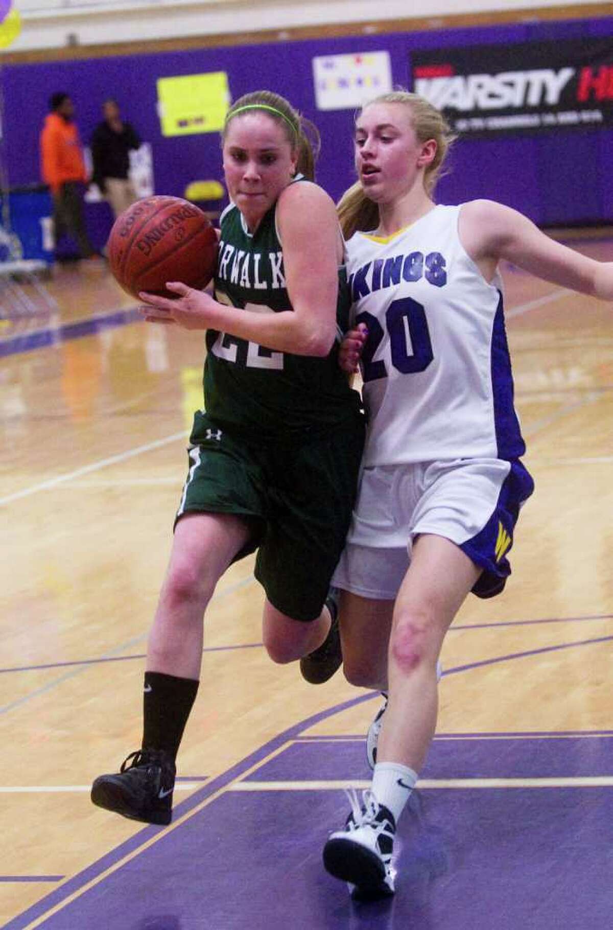 Norwalk's Katie Schmidt and Westhill's Stephanie Roones battlle as Westhill High School hosts Norwalk in a girls basketball game in Stamford, Conn., February 15, 2012.