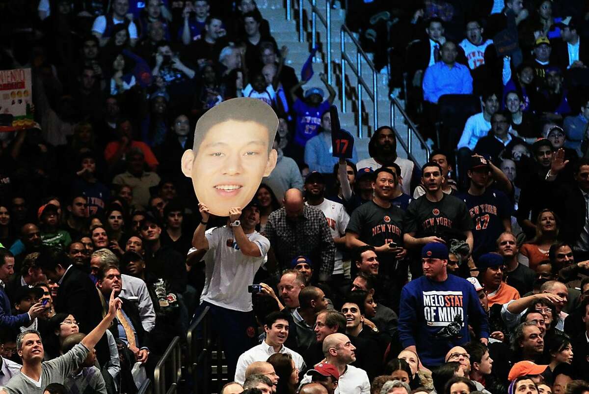 Jeremy Lin #17 of the New York Knicks fans cheer him on against the Sacramento Kings at Madison Square Garden on February 15, 2012 in New York City.