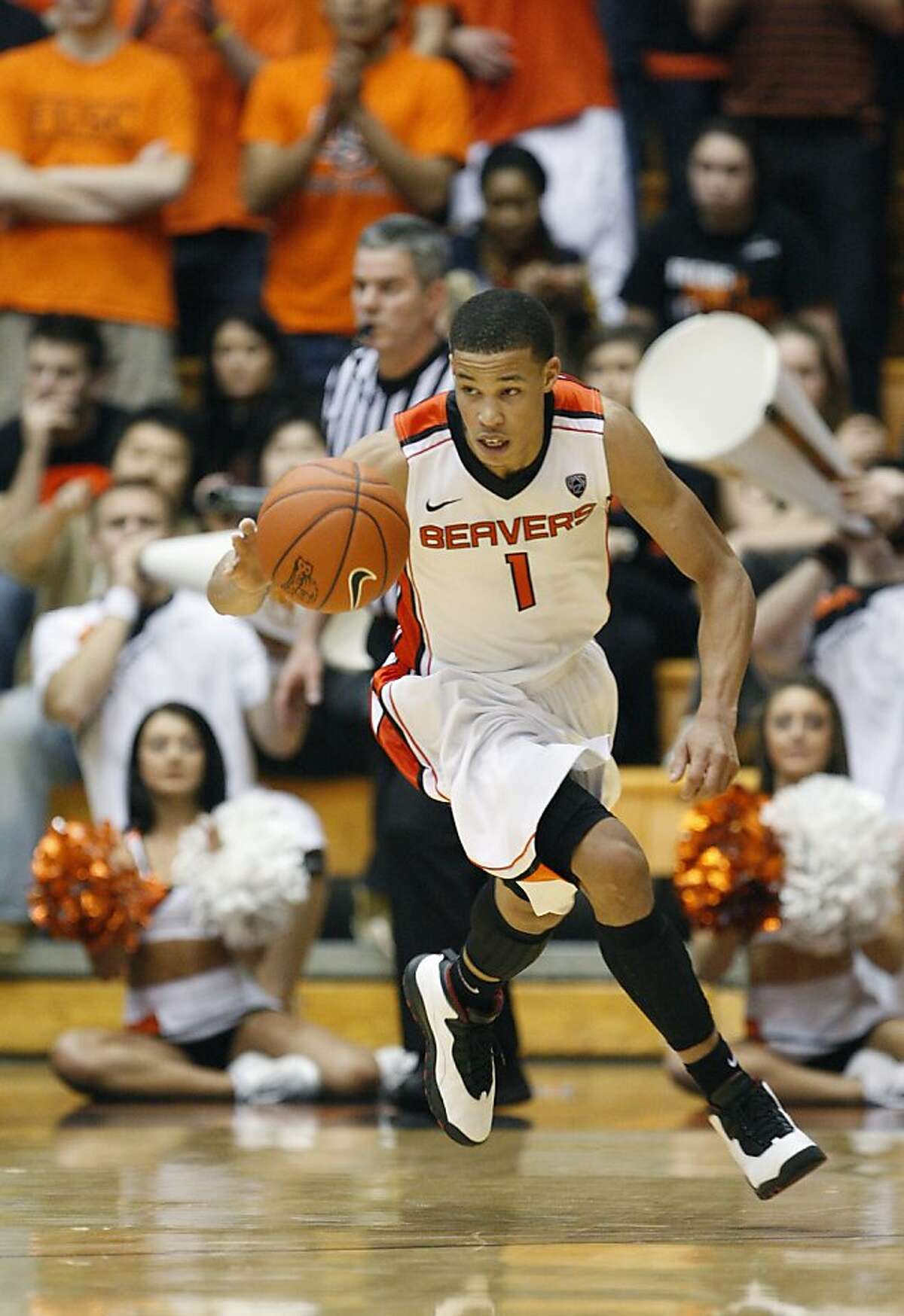 Oregon State guard Jared Cunningham (1) brings the ball up court in the second half during an NCAA college basketball game with Washington State Thursday, Feb. 9, 2012, in Corvallis, Ore.