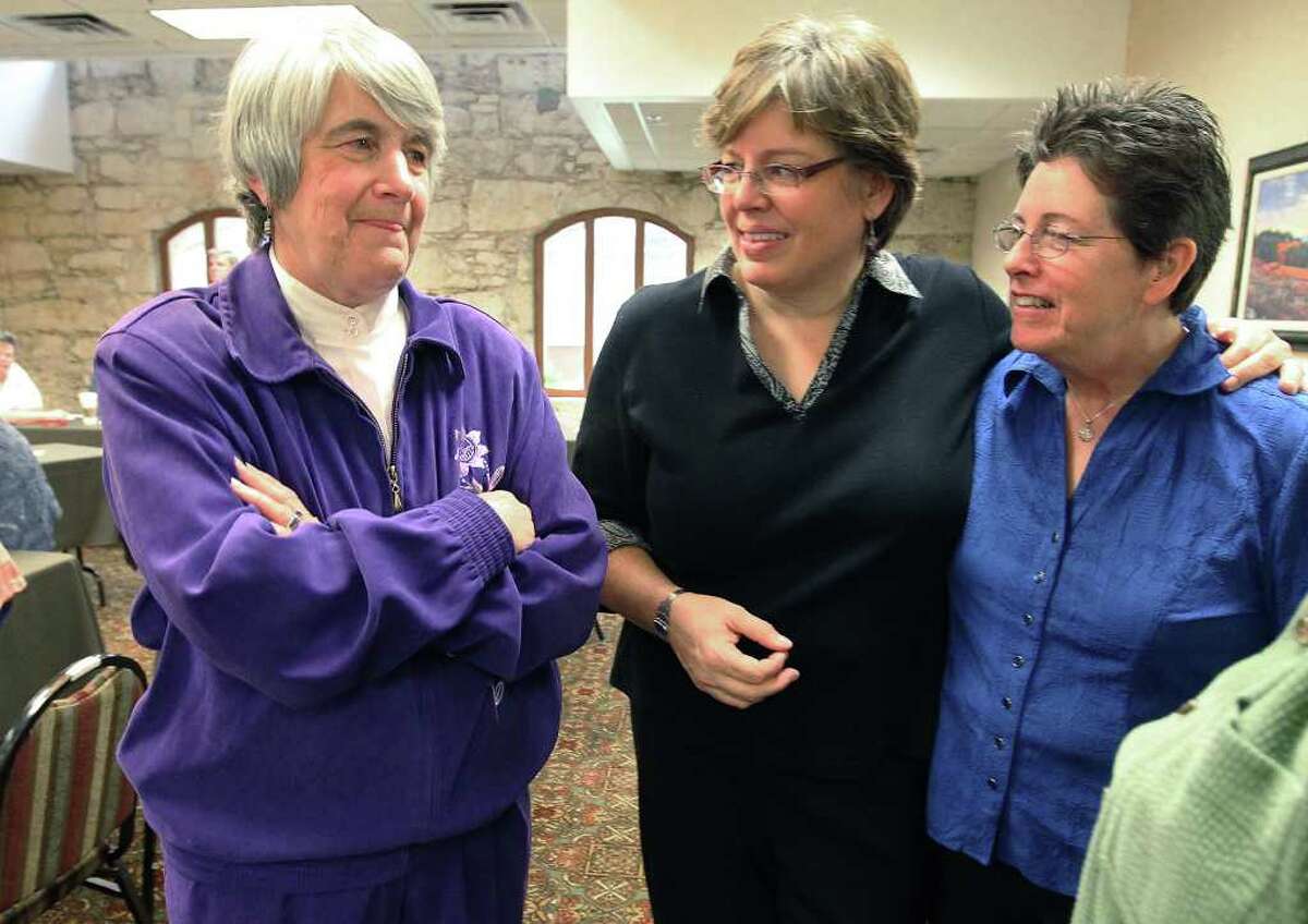 Presbyterian minister Jane Spahr (left) is in San Antonio for a hearing to appeal an earlier conviction of censure by the Presbyterian Church for performing same-sex marriages in California on Feb. 16, 2012. Spahr was chatting with BJ Douglass (center) and Connie Valois - a same-sex couple that she married in California in 2008.