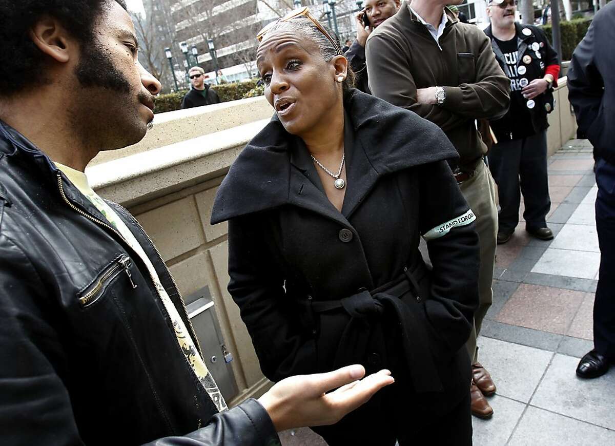 Desley Brooks (center), who sits on the Oakland City Council, stopped to talk with a member of the Occupy movement during a rally by Occupy and anti-Occupy forces in front of Oakland City Hall Monday February 6, 2012.