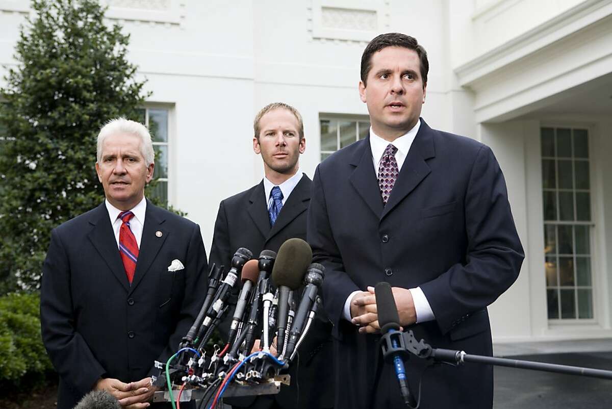 Rep. Jim Costa (D-CA), left, with Jason Hubbard, center, and Rep. Devin Nunes (R-CA) right, speak with the media after attending the signing by President George W. Bush of the Hubbard Act into law Aug. 29, 2008 in Washington, D.C. The Hubbard Act, named for Jason Hubbard, who lost two brothers in Iraq, allows sole survivors who leave a war zone to receive the same military benefits as other combat veterans. (Photo by Brendan Hoffman/Getty Images)