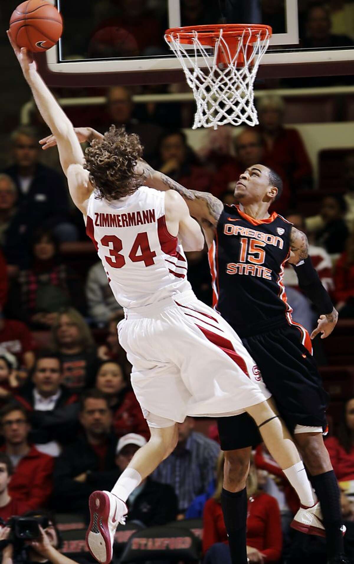Oregon State forward Eric Moreland (15) blocks a shot by Stanford forward Andrew Zimmermann (34) during the second half of an NCAA college basketball game in Stanford, Calif., Thursday, Feb. 16, 2012.