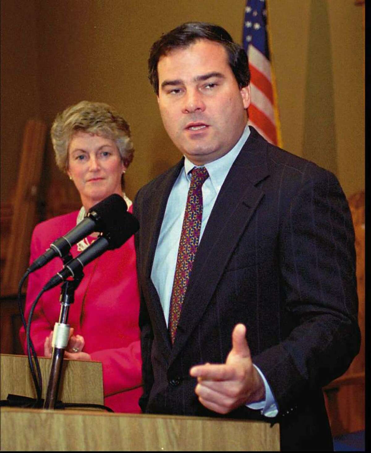 Then Governor-elect John G. Rowland speaks at a news conference at the state capitol in Hartford Wednesday, Nov. 9, 1994, the first day after he won the election. Rowland was 37 at the time. At left is then Lt. Gov.-elect state Rep. Jodi Rell, R-Brookfield. (AP Photo/Bob Child)