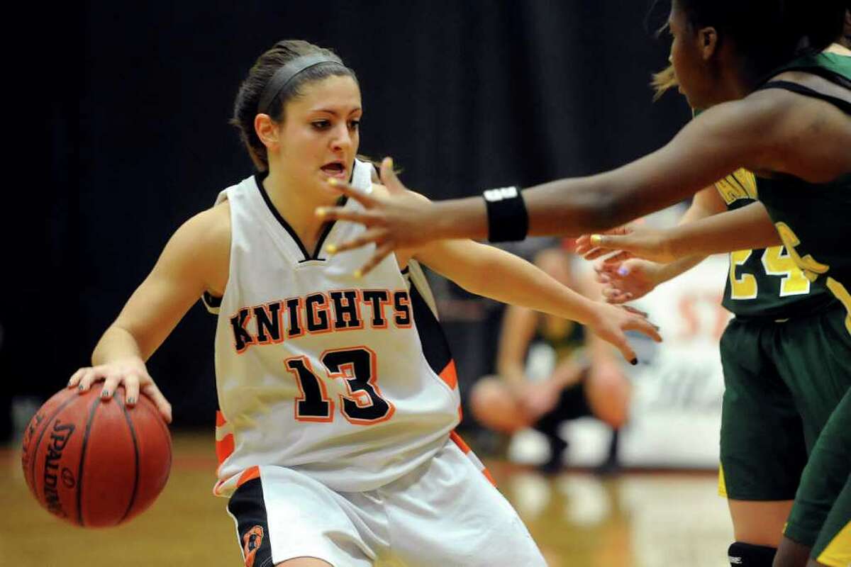 Stamford's Kelsey Cognetta controls the ball during the girls basketball game at Stamford High School on Friday, January 6, 2012.