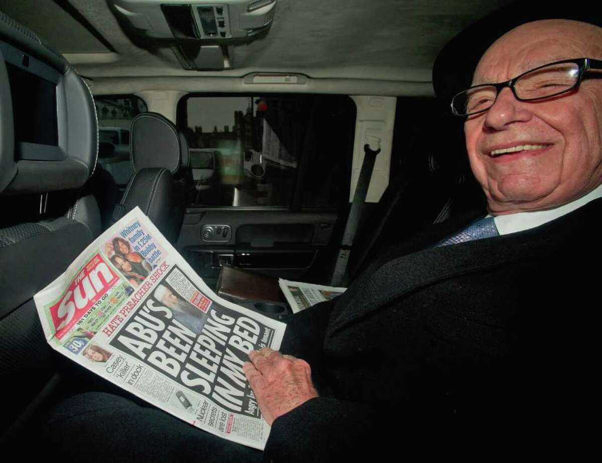 News Corp. chief executive Rupert Murdoch, visiting London, vowed support for his tabloid, The Sun, but he said illegal activities "will not be tolerated."