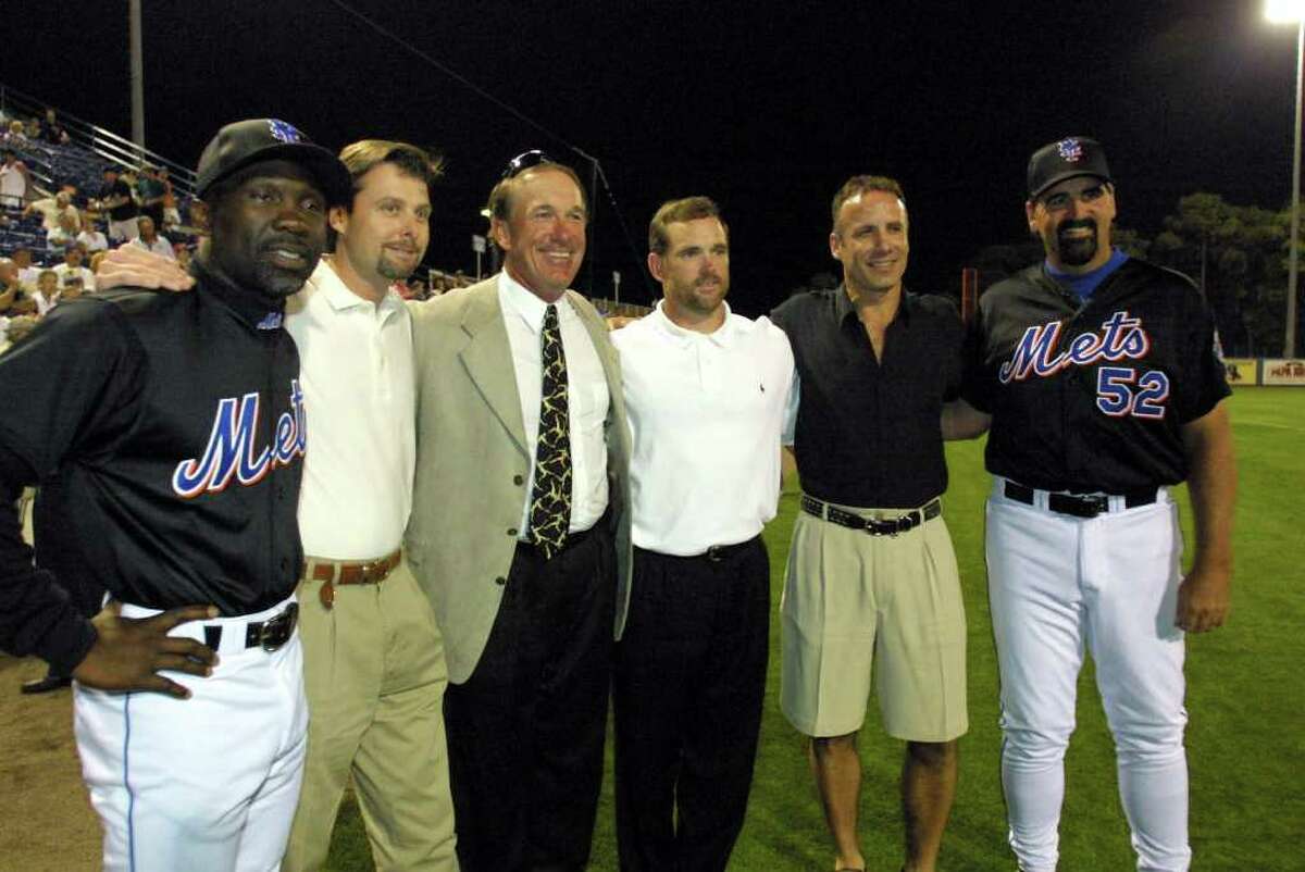 Members of the 1986 New York Mets were honored before the start of the Montreal Expos spring training opener in Port St. Lucie, Fla., Thursday, March 1, 2001. Team members are Mookie Wilson, first base coach; Tim Teufel, Gary Carter, Howard Johnson, Bob Ojeda, and Randy Niemann. (AP Photo/ Gary I. Rothstein)