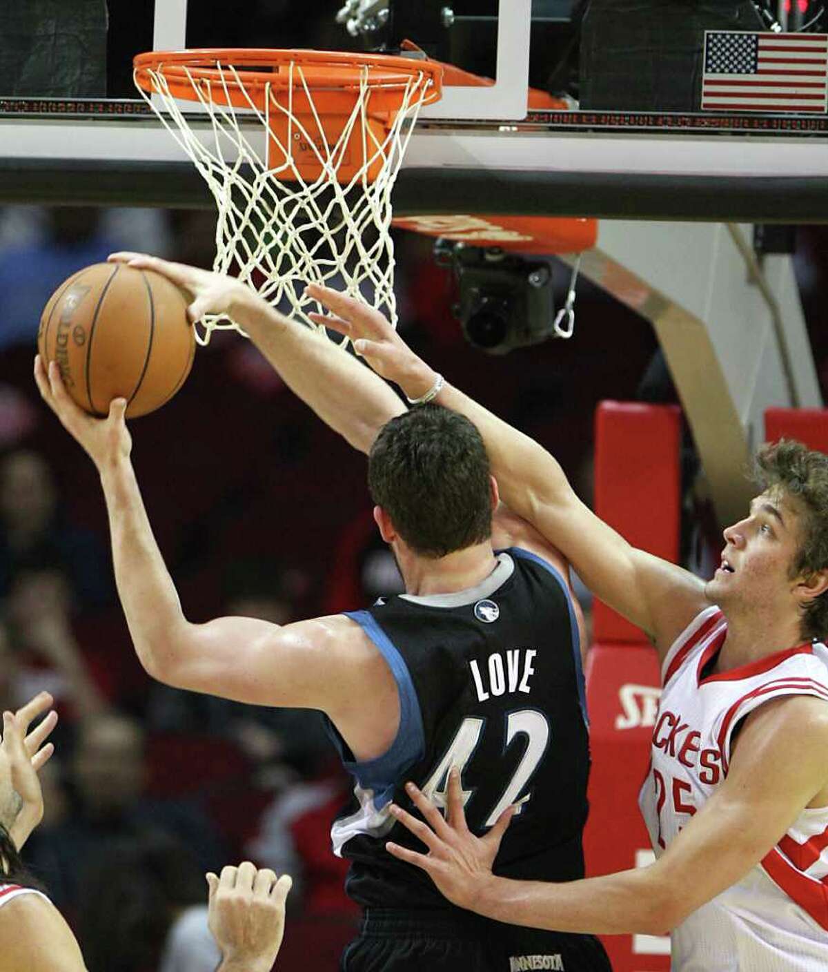 Try though he may, Chandler Parsons finds there's too much Kevin Love, left, between him and the ball.