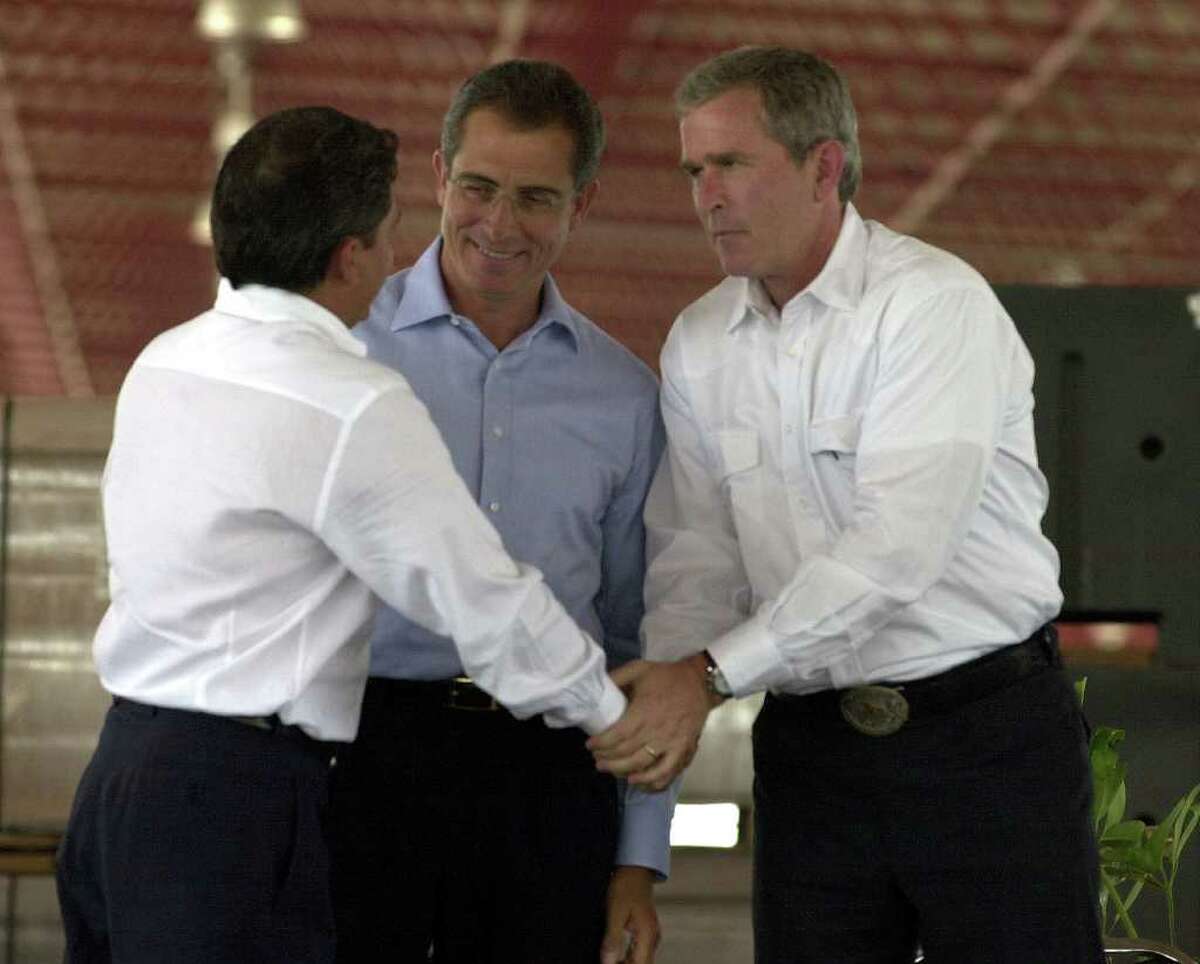 Texas Govonor George W. Bush shakes hands with the Govonor of the state of Tamaulipas, Mexico, Tomas Yarrington, (L) as Mexican President Ernesto Zedillo (C) looks on at cermonies inaugurating the new World Trade Bridge connecting Laredo, Texas and Nuevo Laredo, Mexico. The bridge is only open to commercial traffic and opened officially on April 15. Staff Photo By: John Davenport