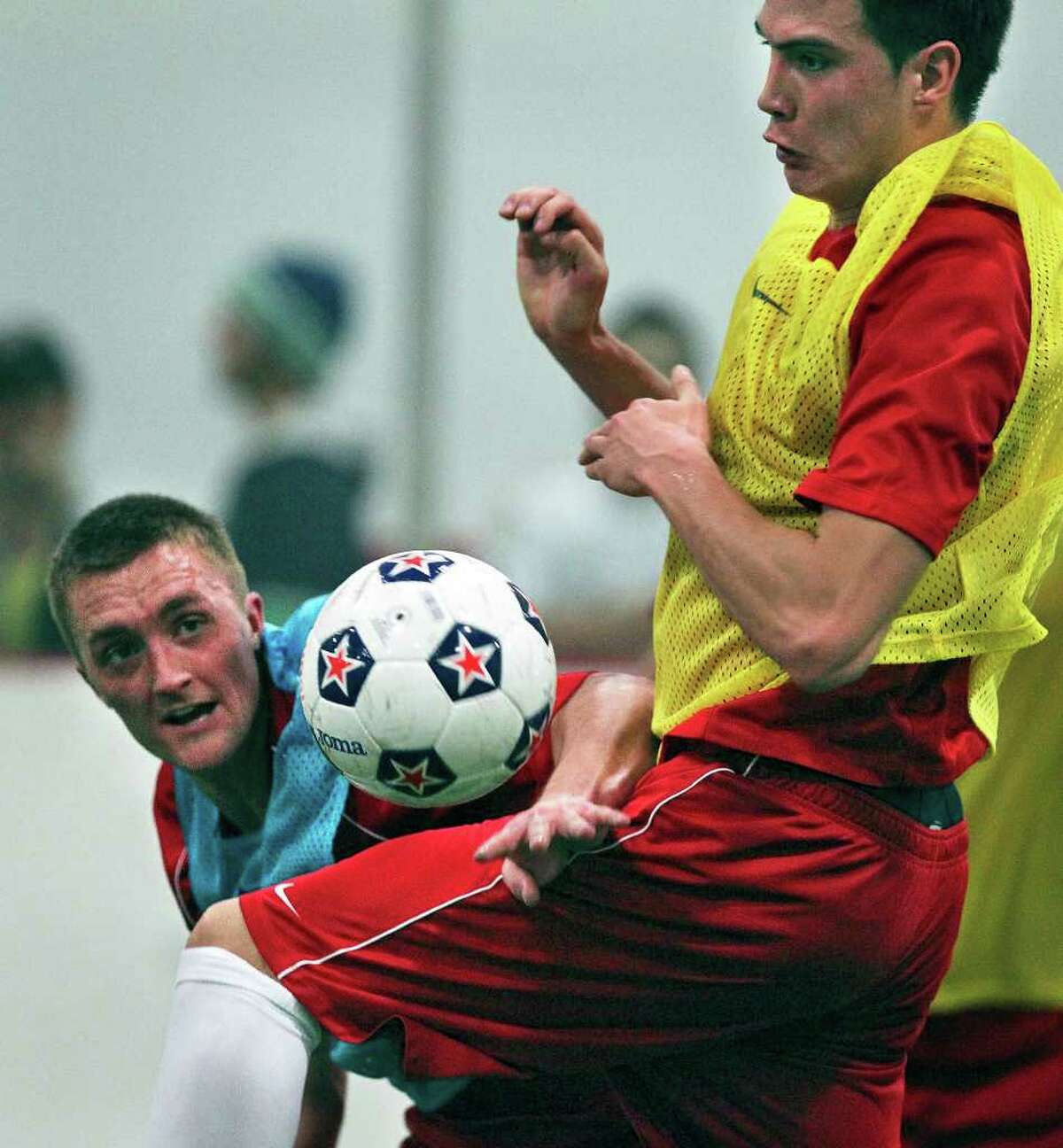 Brandon Swartzendruber (left) battles against Karsten Smith for possession of the ball as the San Antonio Scorpions hold their first practice indoors at the Northwoods on February 18, 2012 Tom Reel/ San Antonio Express-News